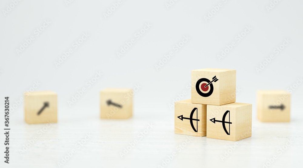 stacked cubes with arrow symbols pointing towards a target on white background stacked cubes with arrow symbols pointing towards a target on white background