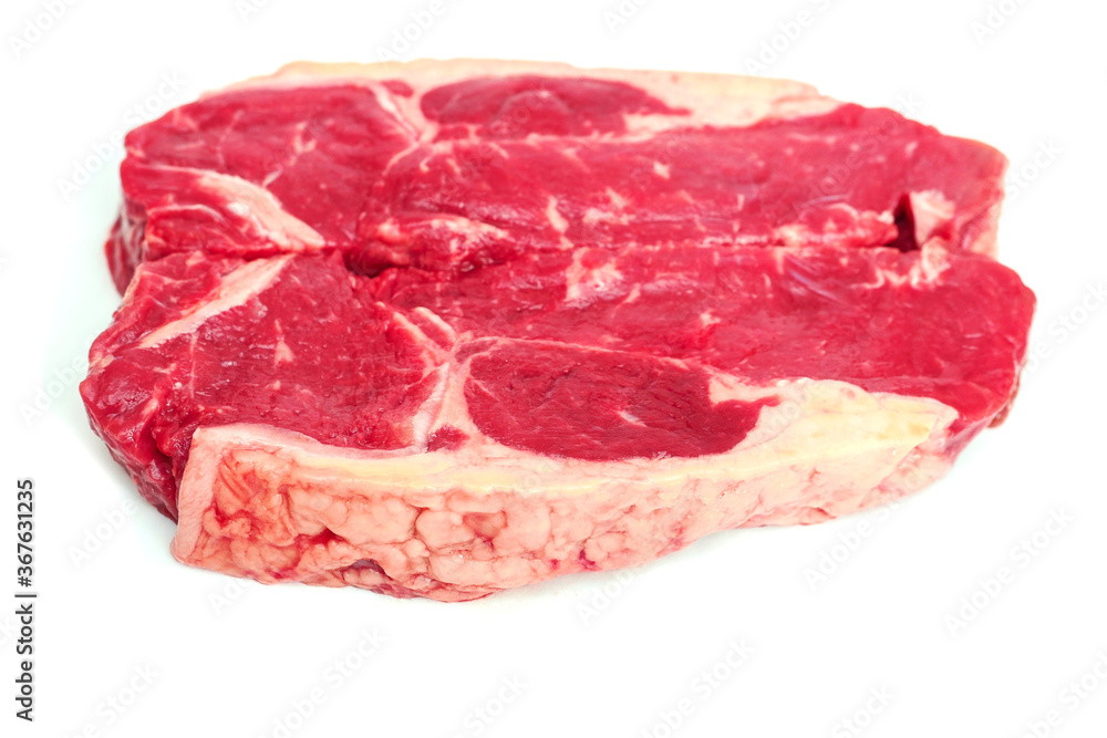 Two fresh strip loin steaks on a white isolated background. Meat industry product.