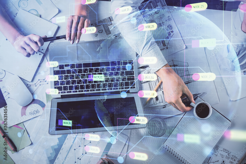 Double exposure of man and woman working together and technology theme drawing hologram. Big data concept. Computer background. Double exposure of man and woman working together and technology theme drawing hologram. Big data concept. Computer background.