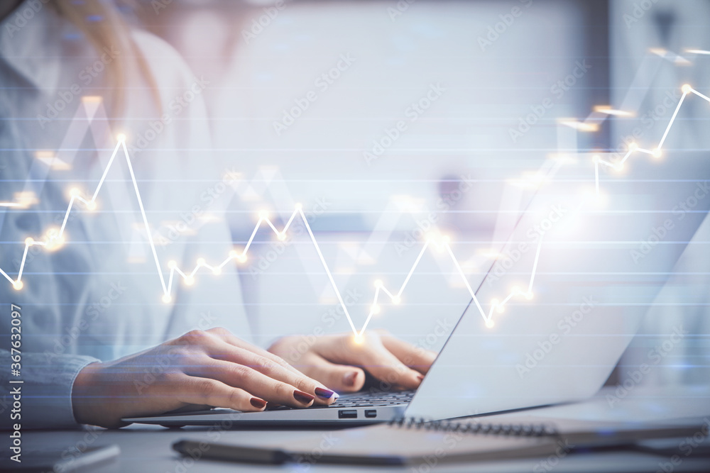 Double exposure of woman hands working on computer and forex graph hologram drawing. Financial analysis concept. Double exposure of woman hands working on computer and forex graph hologram drawing. Financial analysis concept.