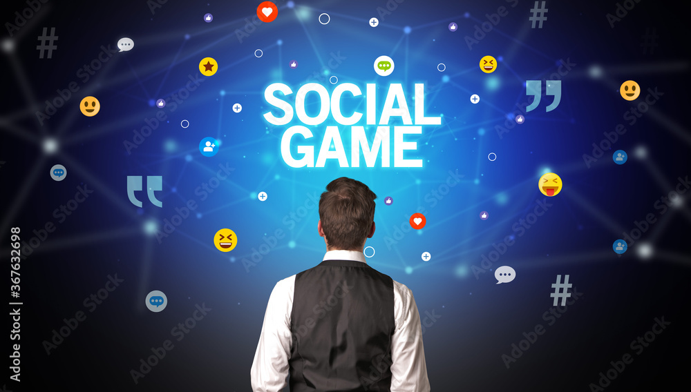 Rear view of a businessman with SOCIAL GAME inscription, social networking concept