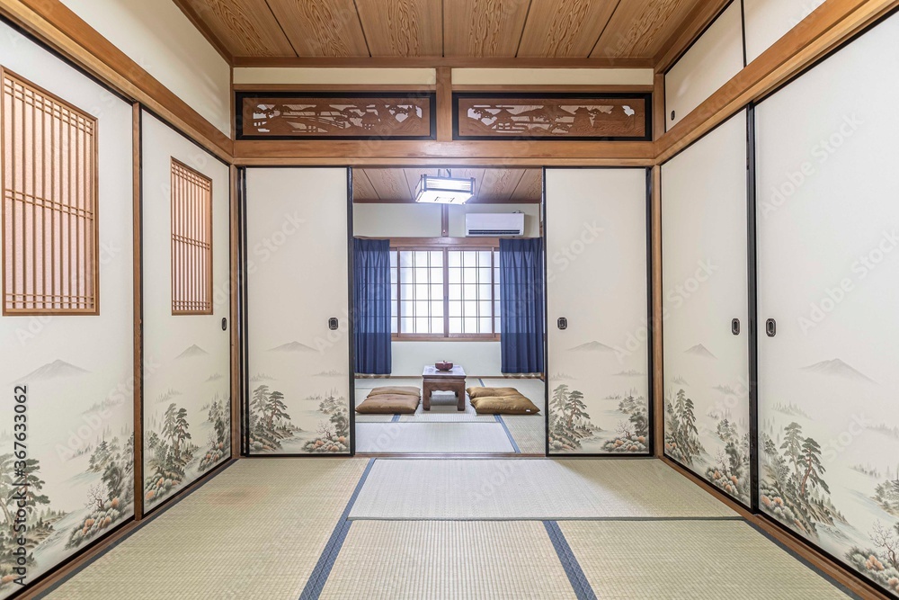 Black wooden table and cushions in the Japanese-style living room Black wooden table and cushions in the Japanese-style living room