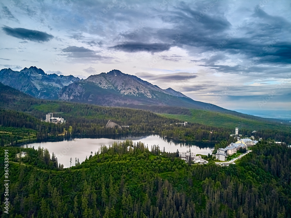 Panoramic view of mountain lake in National Park High Tatra. Strbske pleso, Slovakia, Europe. Beautiful world. Panoramic view of mountain lake in National Park High Tatra. Strbske pleso, Slovakia, Europe. Beautiful world.