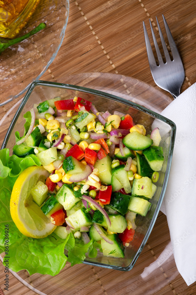 Hawaii style vegetarian raw eating salad.  served in beautiful bowl on white table. flat lay