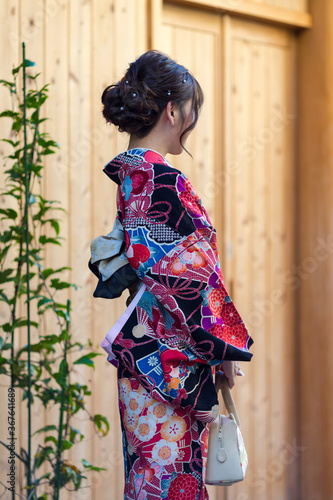 Asian Destinations. Female Geisha in Traditional Japanese Kimono in Kyoto City, Japan.