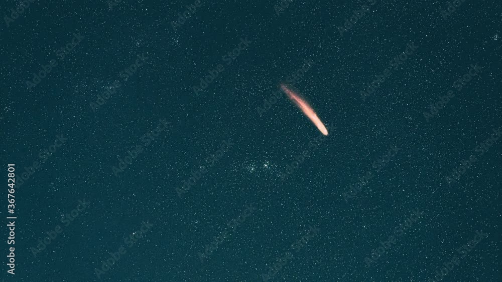The falling comet on the shimmering starry sky background. hyper lapse