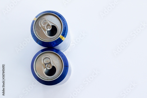 Two beer metal can on white background with copy space.