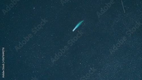 The falling comet on the starry sky background. hyper lapse photo
