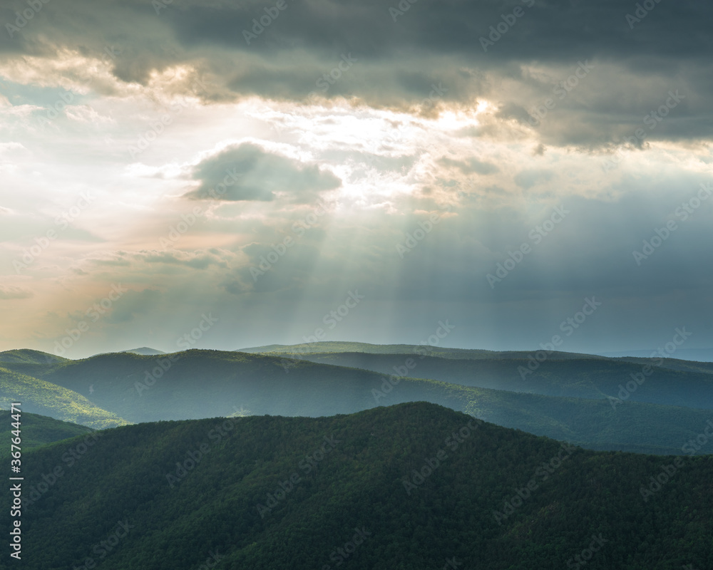 Sunrays burst from Clouds over the mountains. View of Shenandoah valley from Blue Ridge Parkway, Virginia