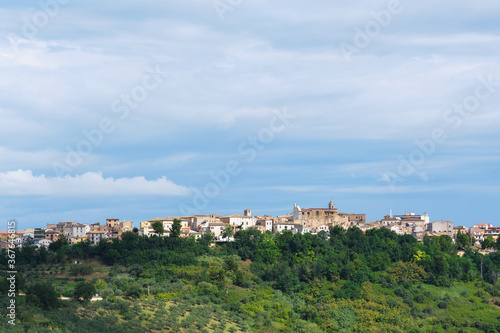 A beautiful italian panorama in the region of Abruzzo with the small village of Pianella on the top of an hill. Bright sunny day with scattered clouds