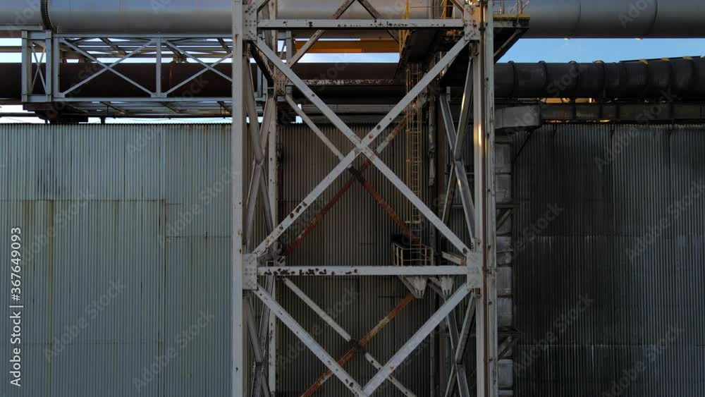 Ascending to the top of an emergency water tower to reveal a steel mill. 4K 29.97fps Ascending to the top of an emergency water tower to reveal a steel mill. 4K 29.97fps