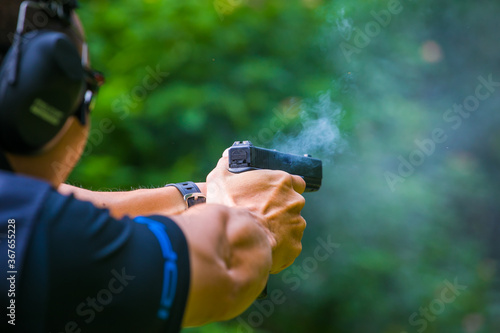 hand gun pistole in a man hand photo