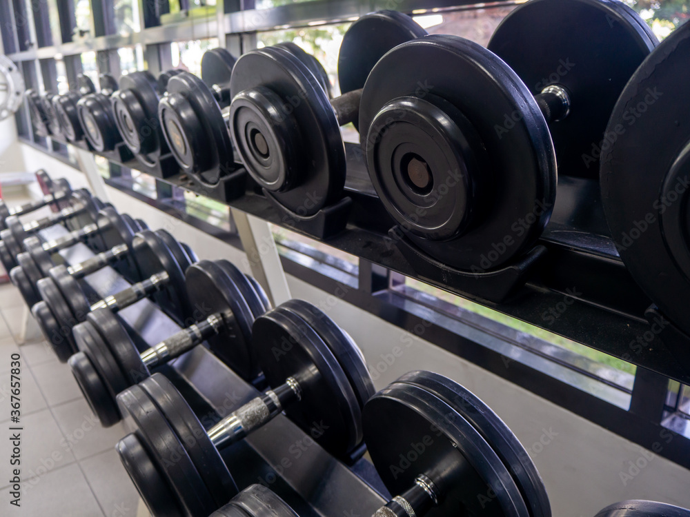 dumbbell set. Close up many metal dumbbells dumbbell set. Close up many metal dumbbells