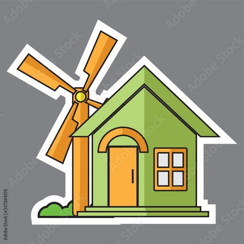 wind turbine beside a house