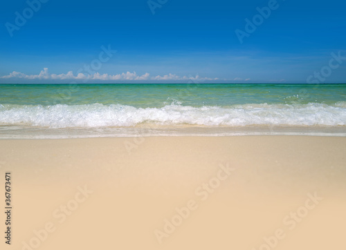 Clouds with blue sky over calm sea beach in tropical Maldives island. Tropical paradise beach with white sand.