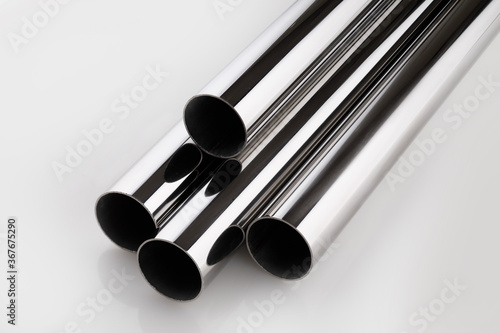 steel tubes and pipes on a white base
