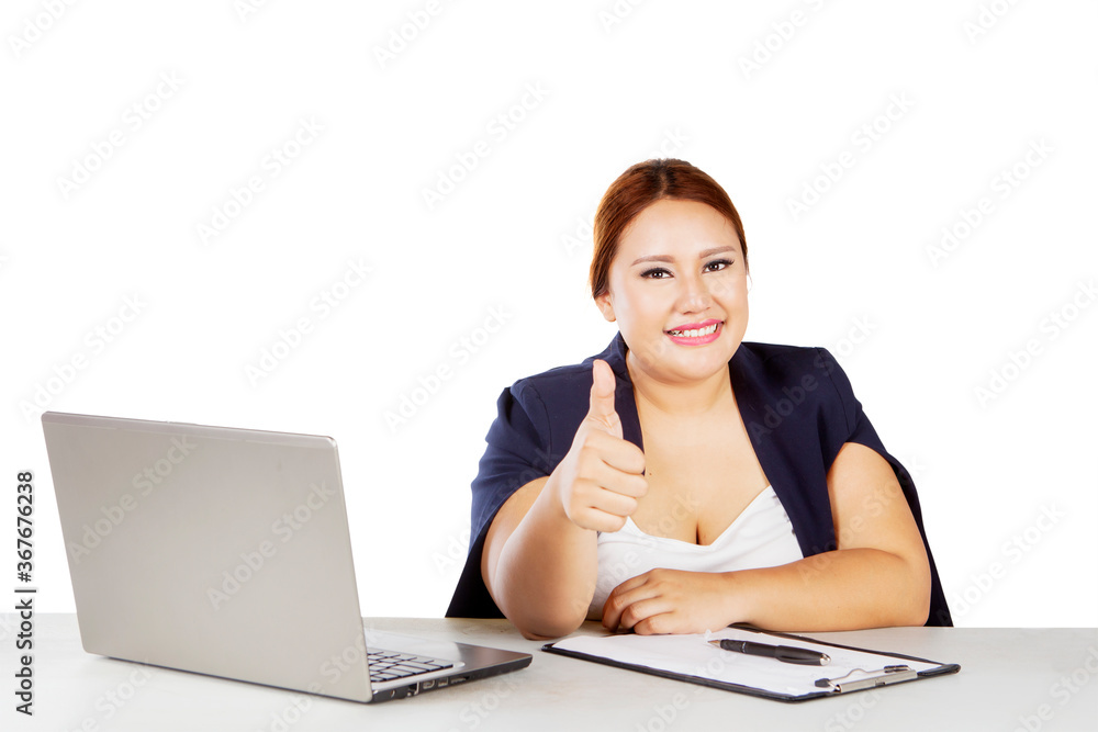 Blonde businesswoman showing thumb up on studio Blonde businesswoman showing thumb up on studio