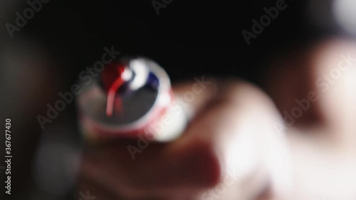 Artist painter squeezing red paint from tube photo