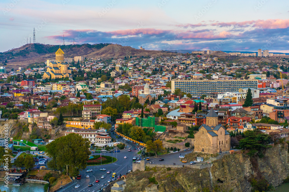 Panorama view of city Tbilisi, the capital in Georgia, at sunset.