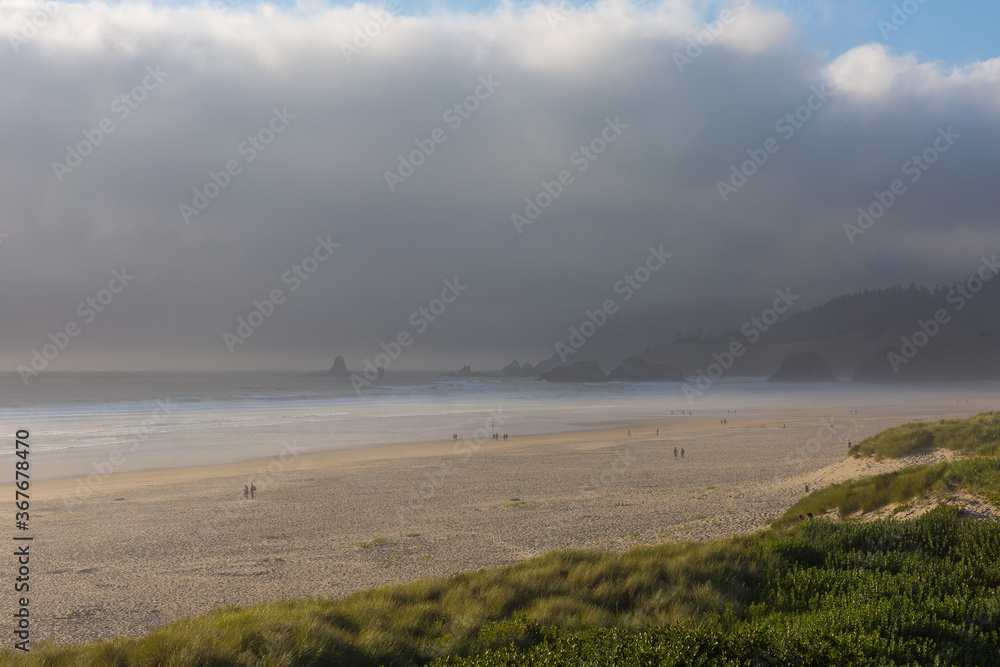 Beautiful misty ocean shore at Cannon Beach, Oregon Beautiful misty ocean shore at Cannon Beach, Oregon