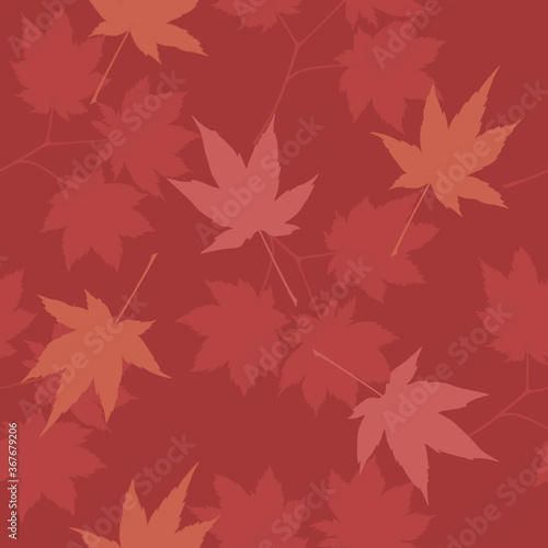 Vector seamless pattern with red and orange maple leaves. Red background