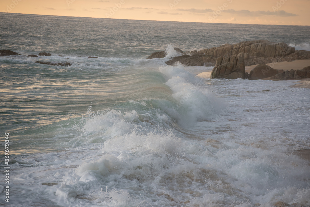 waves of the sea breaking on the beach waves of the sea breaking on the beach