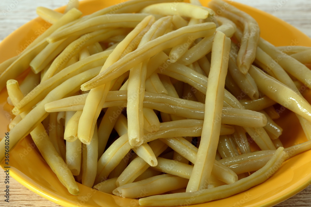 Yellow string beans cooked on plate close up Yellow string beans cooked on plate close up