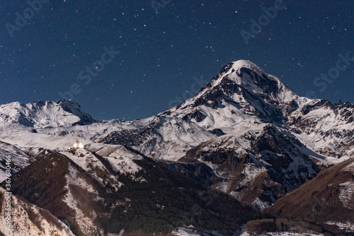 Mountain Kazbagi, a big snow mountain at Caucasus in Georgia, in winter time, at night. © Zimu