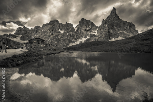 Black and white view of mountain lake in the italian dolomites near Passo Rolle, Trentino