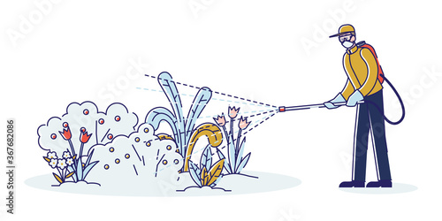 Man spraying pesticide and insecticide on flowers in garden. Chemical treatment of plants concept