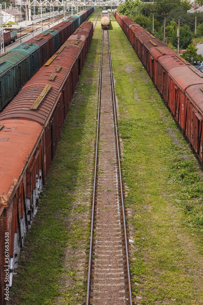 Lutsk, Ukraine, July 22, 2020: A locomotive with freight cars at the railway station Lutsk, Ukraine, July 22, 2020: A locomotive with freight cars at the railway station