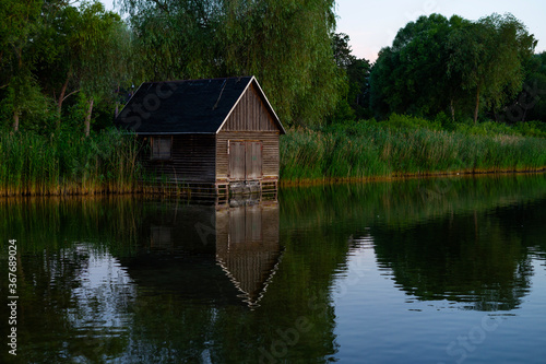 little wooden house at a lake