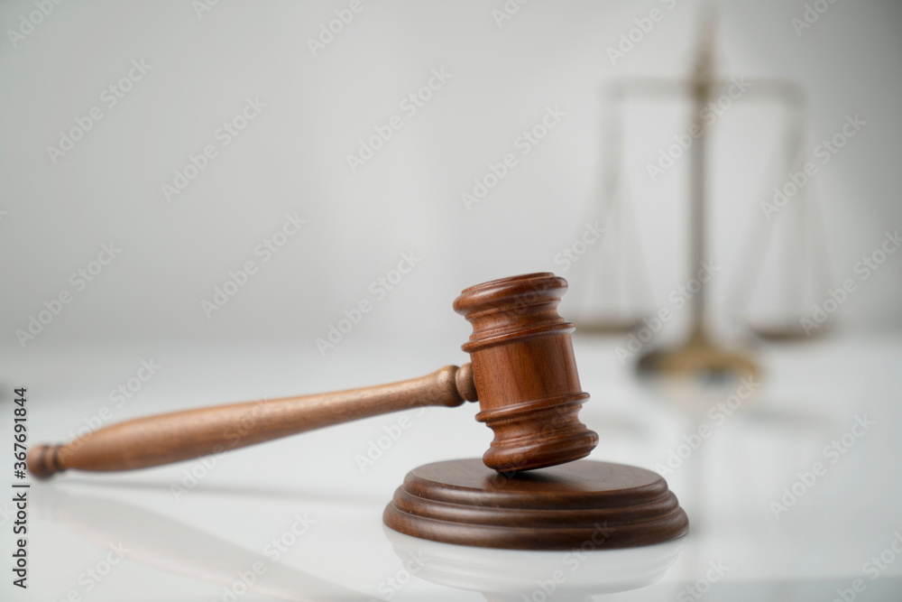 Law and justice concept. Scale, gavel and hourglass on off-white background. Law and justice concept. Scale, gavel and hourglass on off-white background.