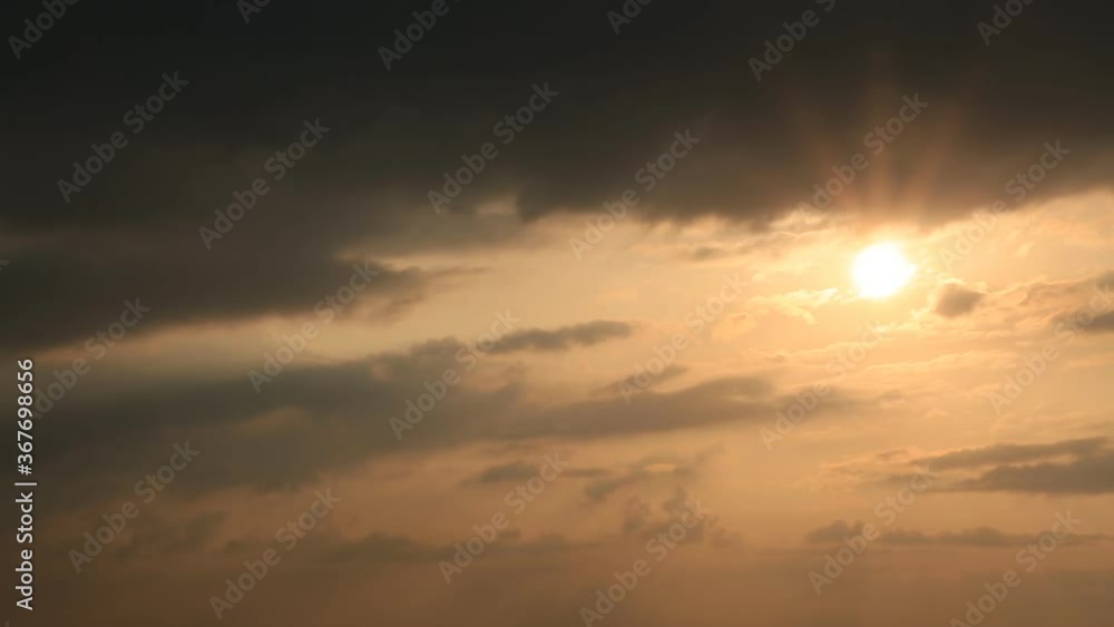 Time lapse of sun and clouds at sunset Time lapse of sun and clouds at sunset