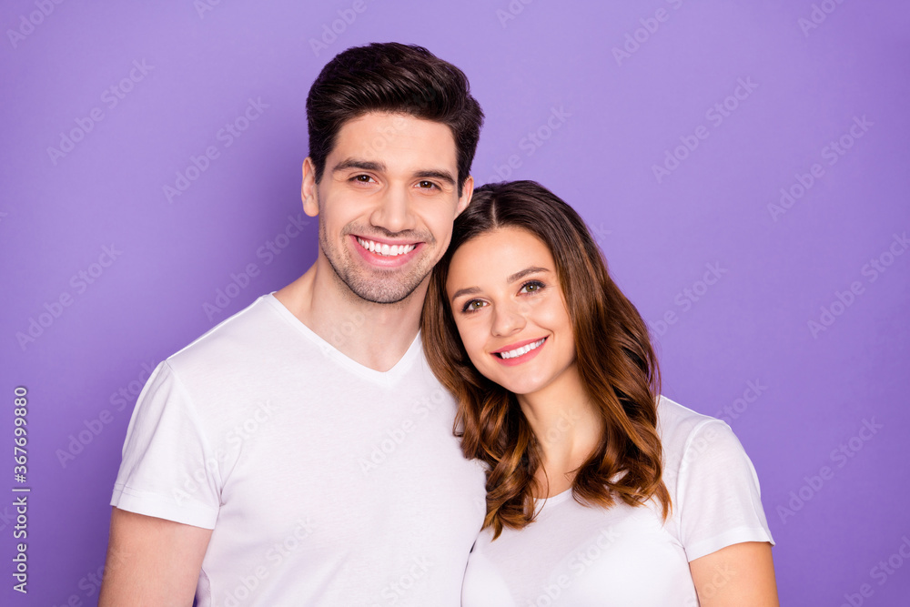 Closeup photo cheerful pretty lady handsome guy couple good mood hugging leaning heads romance date photographing wear casual white t-shirts isolated purple pastel color background Closeup photo cheerful pretty lady handsome guy couple good mood hugging leaning heads romance date photographing wear casual white t-shirts isolated purple pastel color background