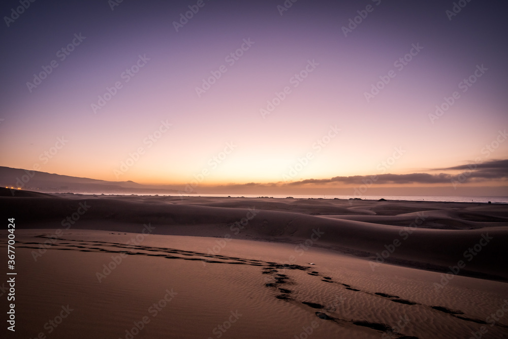 Spectacular Sunrise Sandy dunes in famous natural Maspalomas beach. Gran Canaria. Spain