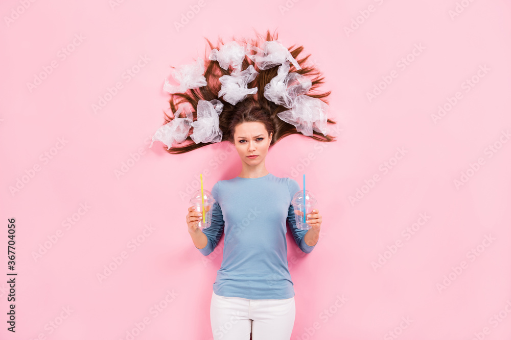Top above high angle view photo of serious girl eco friendly activist hold plastic coffee mug cup beverage bags hair advertise no polluting globe flat lay isolated pastel color background Top above high angle view photo of serious girl eco friendly activist hold plastic coffee mug cup beverage bags hair advertise no polluting globe flat lay isolated pastel color background