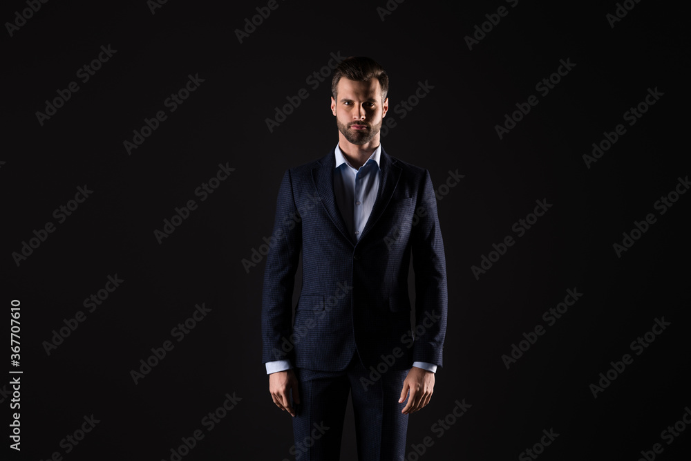 Portrait of his he nice attractive content perfect elegant rich wealthy guy model corporate leader mr mister wearing expensive good suit apparel isolated on dark black color background Portrait of his he nice attractive content perfect elegant rich wealthy guy model corporate leader mr mister wearing expensive good suit apparel isolated on dark black color background