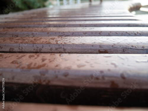 Close up of drops on the bench.