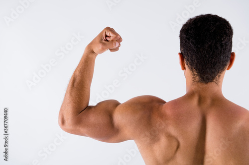 Close-up cropped rear back beind view of his he nice attractive powerful successful professional sportive guy trainer coach showing muscles motivation isolated over light white pastel color background