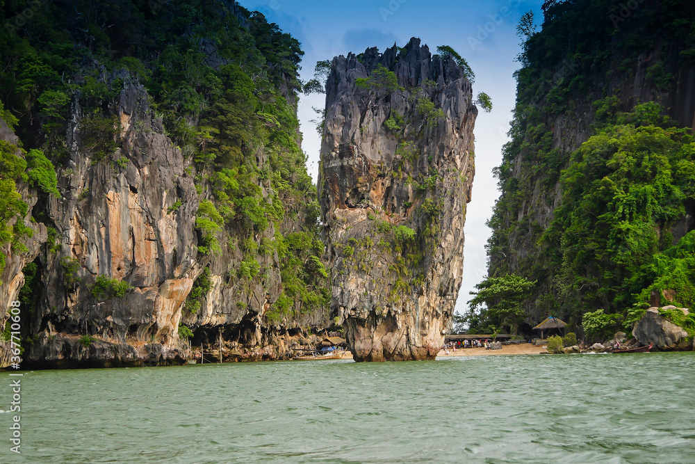 Eroded overgrown limestone rocks in Phang Nga Bay,James bond island, Ao Phang Nga Marine National Park, Thailand,