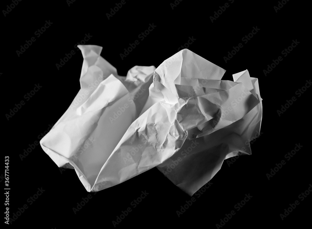 Crumpled white paper sheet isolated on black background with clipping path