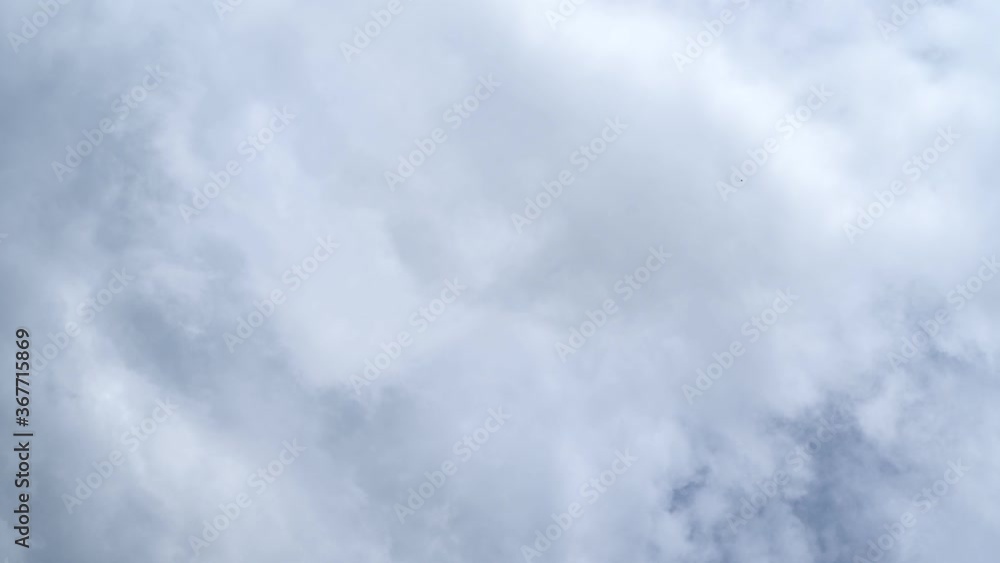 timelapse, white clouds on a blue sky. Unrealistic rapid movement of white clouds in the blue sky. movement of clouds filling the space.