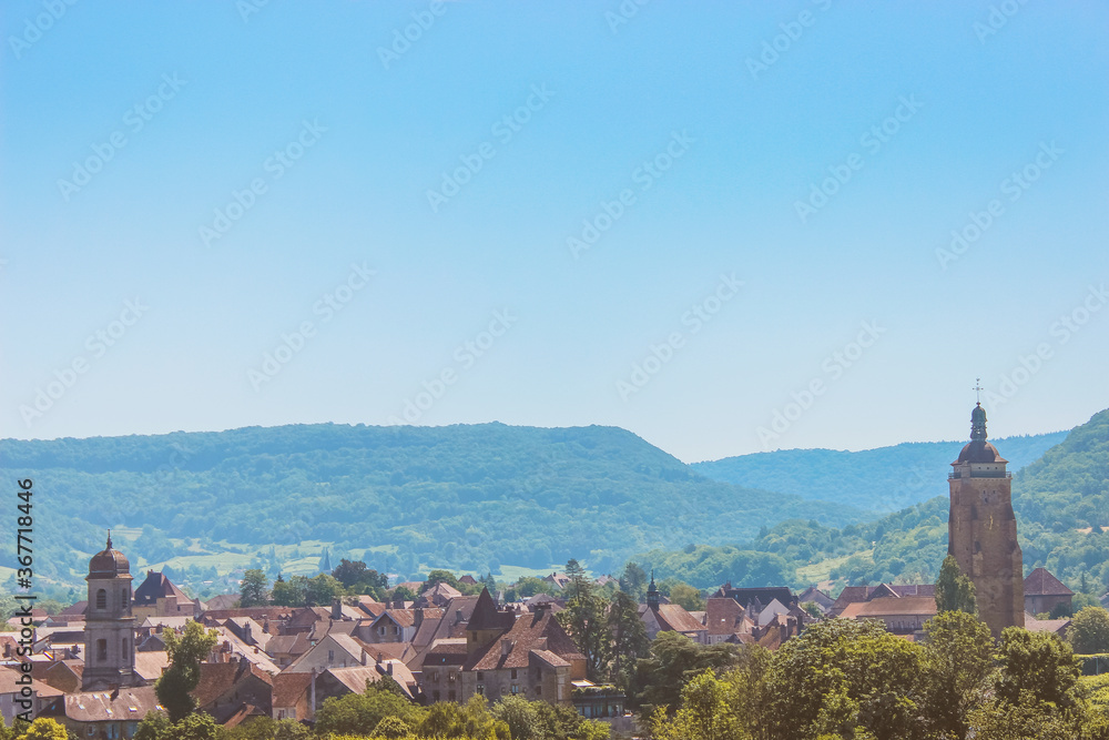 panorama of the old town. summer landscape with road and mountains