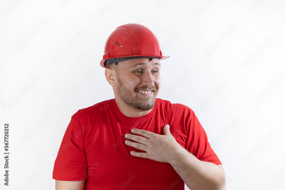 The builder laughs. The man in the construction helmet and red T-shirt. Funny builder.
