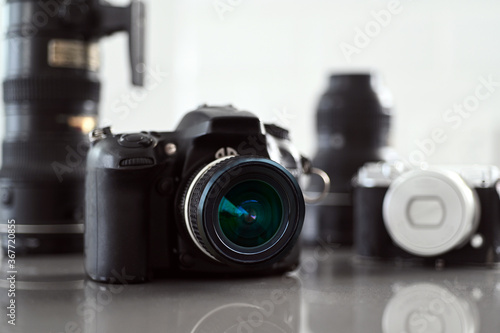 Cameras and lenses photography equipment on a marble surfac