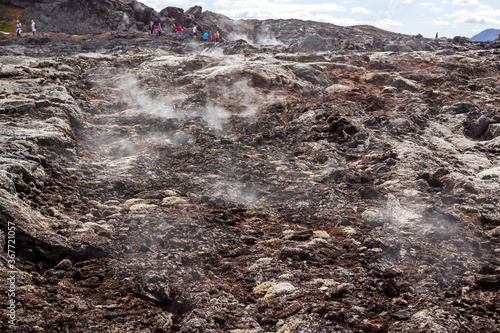 Fields of recent lava at Leirhnjukur volcano, Iceland,full of steaming fumaroles 