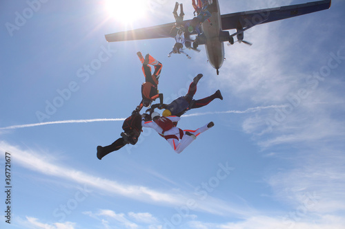 Skydiving. Skydivers have just jumped out of a plane.