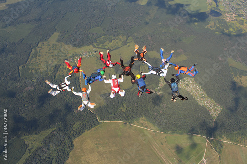 A group of skydivers is in the sky.