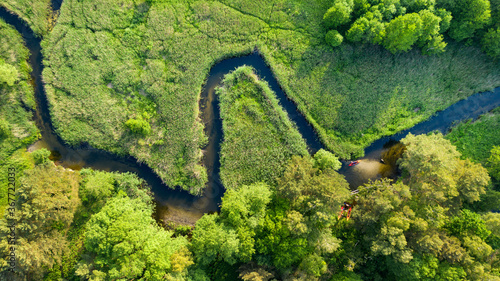 Drone shot of natual river during summer with canoeing peoples photo